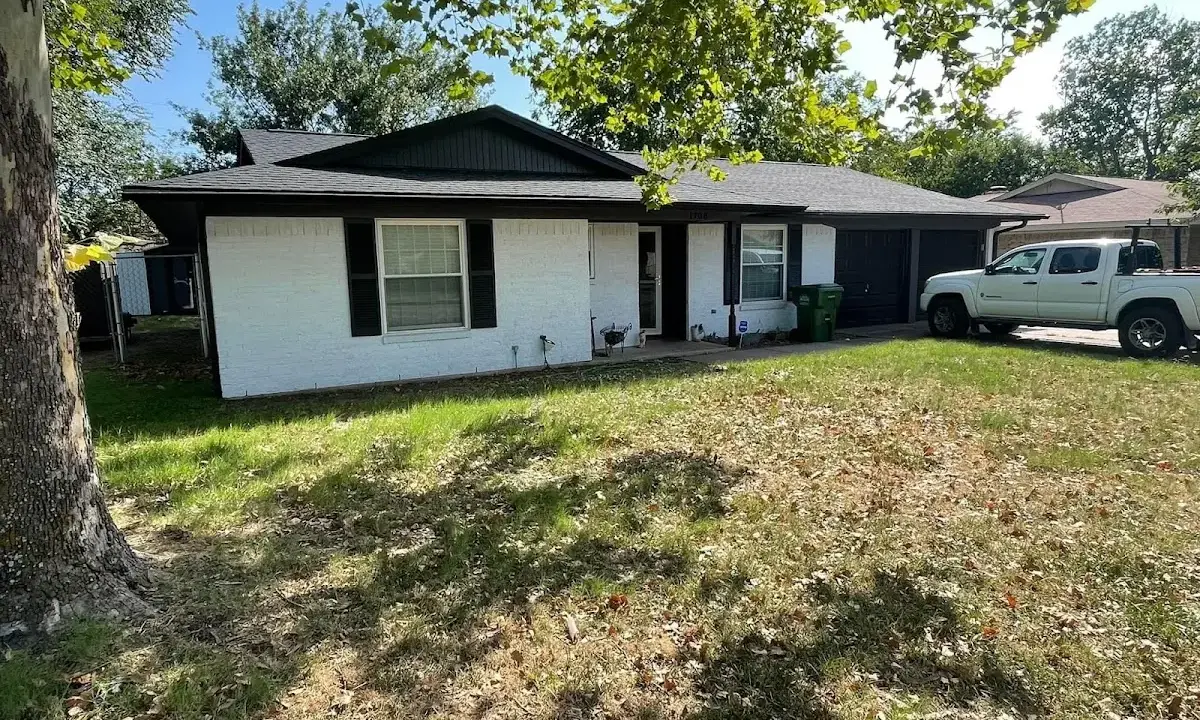 Professional roofing crew working on a residential roof in Avon Lake